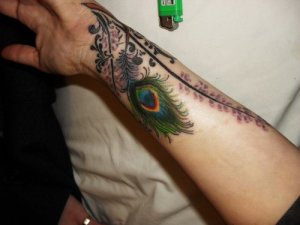 colorful peacock feathers tattoos