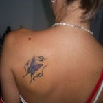 back of shoulder tattoo placement